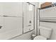 Clean bathroom with tub and shower combination, white subway tile, and modern fixtures at 16018 Volterra Pt, Bella Collina, FL 34756