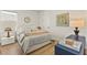 Cozy bedroom with a plush bed, stylish furnishings, and bright natural light streaming through the window at 16018 Volterra Pt, Bella Collina, FL 34756