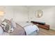 This bedroom boasts wood-look floors, a comfortable bed, and modern decor at 16018 Volterra Pt, Bella Collina, FL 34756