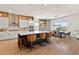 Spacious kitchen with island, modern appliances, barstool seating, and an eat-in dining area at 16018 Volterra Pt, Bella Collina, FL 34756