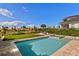 Inviting in-ground pool with a beautiful backyard view of well-manicured landscaping at 16018 Volterra Pt, Bella Collina, FL 34756