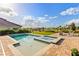 Backyard pool and spa with brick paver patio and a view of the community at 16018 Volterra Pt, Bella Collina, FL 34756