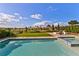Inviting pool featuring spa, adjacent turf and chairs with scenic views beyond the fence at 16018 Volterra Pt, Bella Collina, FL 34756