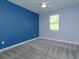 Bedroom with a ceiling fan, light-colored carpet, and natural light from the window at 1628 Little Wren Ln, Winter Park, FL 32792