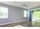Bedroom with large windows offering lots of natural light and sliding doors leading to the screened patio at 1628 Little Wren Ln, Winter Park, FL 32792