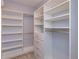 Spacious walk-in closet with built-in shelving and drawers, offering ample storage at 1628 Little Wren Ln, Winter Park, FL 32792