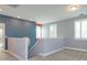 Bright and open hallway features neutral colors and leads to multiple rooms with great natural light at 1628 Little Wren Ln, Winter Park, FL 32792