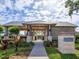Community hideaway/pavilion with stone pillars, landscaping and walkway at 1628 Little Wren Ln, Winter Park, FL 32792