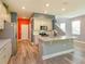 Bright, open kitchen with a granite island, stainless steel appliances, and white cabinets at 1628 Little Wren Ln, Winter Park, FL 32792