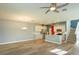 Open-concept kitchen and living area, featuring a spacious island, stainless steel appliances and hardwood floors at 1628 Little Wren Ln, Winter Park, FL 32792