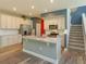 Bright, open kitchen with a granite island, stainless steel appliances, and white cabinets at 1628 Little Wren Ln, Winter Park, FL 32792