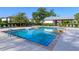 Community pool with lounge chairs and shaded pavilion at 1628 Little Wren Ln, Winter Park, FL 32792