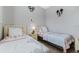 Charming bedroom with two beds, themed decor and a cozy atmosphere for or guests at 16810 Sunrise Vista Dr, Clermont, FL 34714