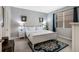 Bright bedroom with neutral tones, a patterned rug, and ample natural light for relaxation at 16810 Sunrise Vista Dr, Clermont, FL 34714
