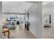 Open hallway with neutral tile leading to the bedroom and living areas, offering an open floor plan at 16810 Sunrise Vista Dr, Clermont, FL 34714