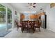 Open-concept kitchen with stainless steel appliances, oak cabinets, and a clear view of the outdoor patio at 16810 Sunrise Vista Dr, Clermont, FL 34714