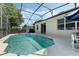 Inviting screened-in pool with clear blue water, spacious patio area, and comfortable seating at 16810 Sunrise Vista Dr, Clermont, FL 34714