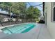 Inviting screened-in pool with clear blue water, spacious patio area, and lush landscaping at 16810 Sunrise Vista Dr, Clermont, FL 34714