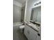 Beautiful bathroom featuring granite countertops, a vanity sink, and a bathtub at 1734 Sail Ct, Kissimmee, FL 34759
