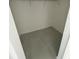 Empty walk-in closet with rod for hanging clothing and room for storage at 1734 Sail Ct, Kissimmee, FL 34759