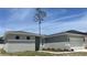 Charming single-story home with a two-car garage and well-manicured lawn at 1734 Sail Ct, Kissimmee, FL 34759