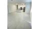 Spacious living room with tile flooring, an island, and modern appliances at 1734 Sail Ct, Kissimmee, FL 34759