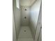 Modern shower with white tile and modern fixtures at 1734 Sail Ct, Kissimmee, FL 34759