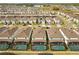 An aerial shot of many new homes in a neighborhood, each with backyard pools at 2036 Lelani Cir, Davenport, FL 33897