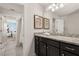 Bathroom with a double sink vanity, ample counter space, and neutral decor at 2036 Lelani Cir, Davenport, FL 33897