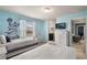 Bright bedroom with twin beds, a TV, ensuite bathroom, and cheerful decor at 2036 Lelani Cir, Davenport, FL 33897
