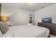 Bright bedroom featuring modern decor, a television, and ample natural light at 2036 Lelani Cir, Davenport, FL 33897