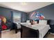 Themed bedroom with custom wall art and cozy beds, ideal for young adventurers at 2036 Lelani Cir, Davenport, FL 33897
