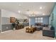 Cozy bonus room featuring plush carpet, a comfortable sectional sofa, and stylish decor at 2036 Lelani Cir, Davenport, FL 33897