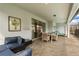 Relaxing screened patio boasts comfortable seating, a dining area, and smooth access to the house at 2036 Lelani Cir, Davenport, FL 33897