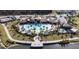 Stunning aerial view of community pool and amenities, showcasing the recreational opportunities available to residents at 2214 Centerra Loop, Kissimmee, FL 34741