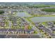 A lovely aerial view of the townhome and neighborhood with ponds and natural surroundings nearby at 2214 Centerra Loop, Kissimmee, FL 34741