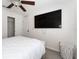 Bedroom with a large wall mounted television and walk in closet at 2214 Centerra Loop, Kissimmee, FL 34741