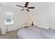 Bedroom featuring a ceiling fan and a window for natural light at 2214 Centerra Loop, Kissimmee, FL 34741