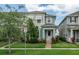 Inviting townhome exterior featuring a well-maintained lawn and colorful landscaping enhancing the property's appeal at 2214 Centerra Loop, Kissimmee, FL 34741