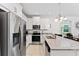 Bright kitchen features stainless steel appliances, granite countertops, and a breakfast bar at 2214 Centerra Loop, Kissimmee, FL 34741