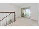 Open loft area with sliding glass doors that leads to a balcony at 2214 Centerra Loop, Kissimmee, FL 34741