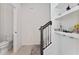 Stairway featuring a half bath and display shelves for a decorative touch at 2214 Centerra Loop, Kissimmee, FL 34741