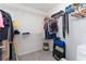 Walk-in closet with ample shelving and hanging space, providing organized storage for clothing and accessories at 2214 Centerra Loop, Kissimmee, FL 34741