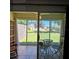 View of backyard from sunroom featuring a table with chairs on a tiled floor at 240 Windmeadows St # 240, Altamonte Springs, FL 32701