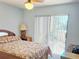 Bedroom with sliding glass doors that give access to the outside patio at 240 Windmeadows St # 240, Altamonte Springs, FL 32701