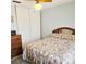 Comfortable bedroom featuring neutral walls, a ceiling fan, and a built in closet at 240 Windmeadows St # 240, Altamonte Springs, FL 32701