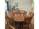 Open-concept dining and living area showcasing a large wooden dining table and access to a cozy living room space at 240 Windmeadows St # 240, Altamonte Springs, FL 32701