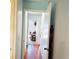 Hallway view leading to office with natural lighting and a workspace at 240 Windmeadows St # 240, Altamonte Springs, FL 32701