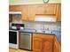 Well-equipped kitchen features stainless steel appliances, ample counter space, and wood cabinets at 240 Windmeadows St # 240, Altamonte Springs, FL 32701