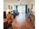 Spacious living room with hardwood floors and natural light streaming through the sliding glass doors at 240 Windmeadows St # 240, Altamonte Springs, FL 32701